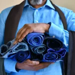 man-holding-blue-ties